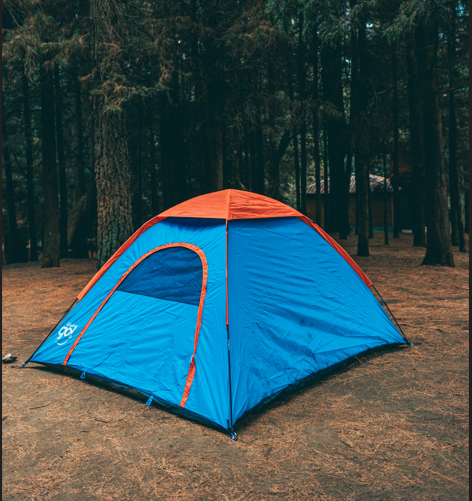 Blue single Text installed in a camping site in front of ravine