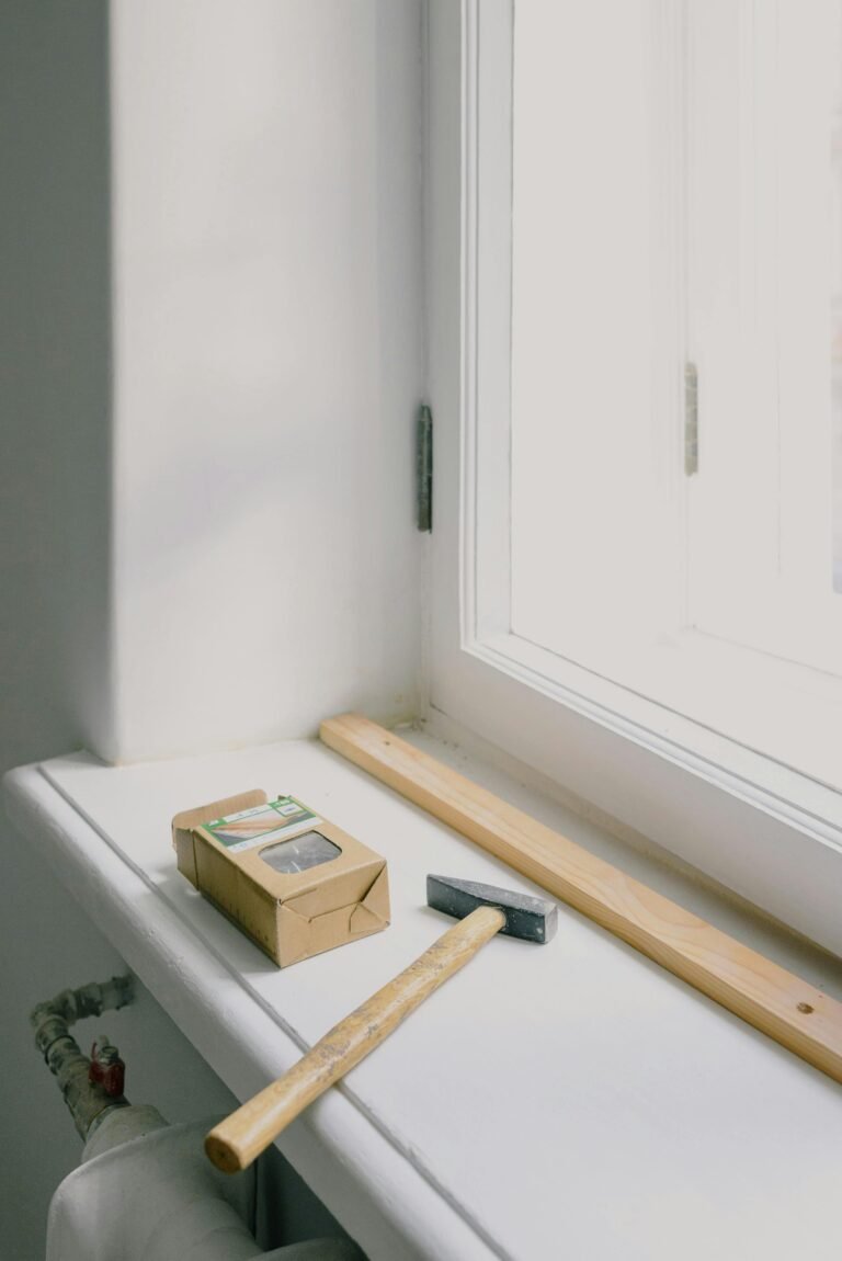 Window with a hammer and a door lock with a wood strip