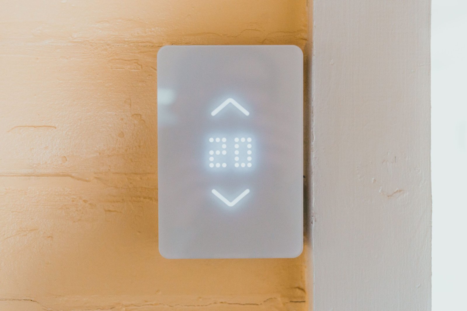 Smart home thermostat displaying temparature.